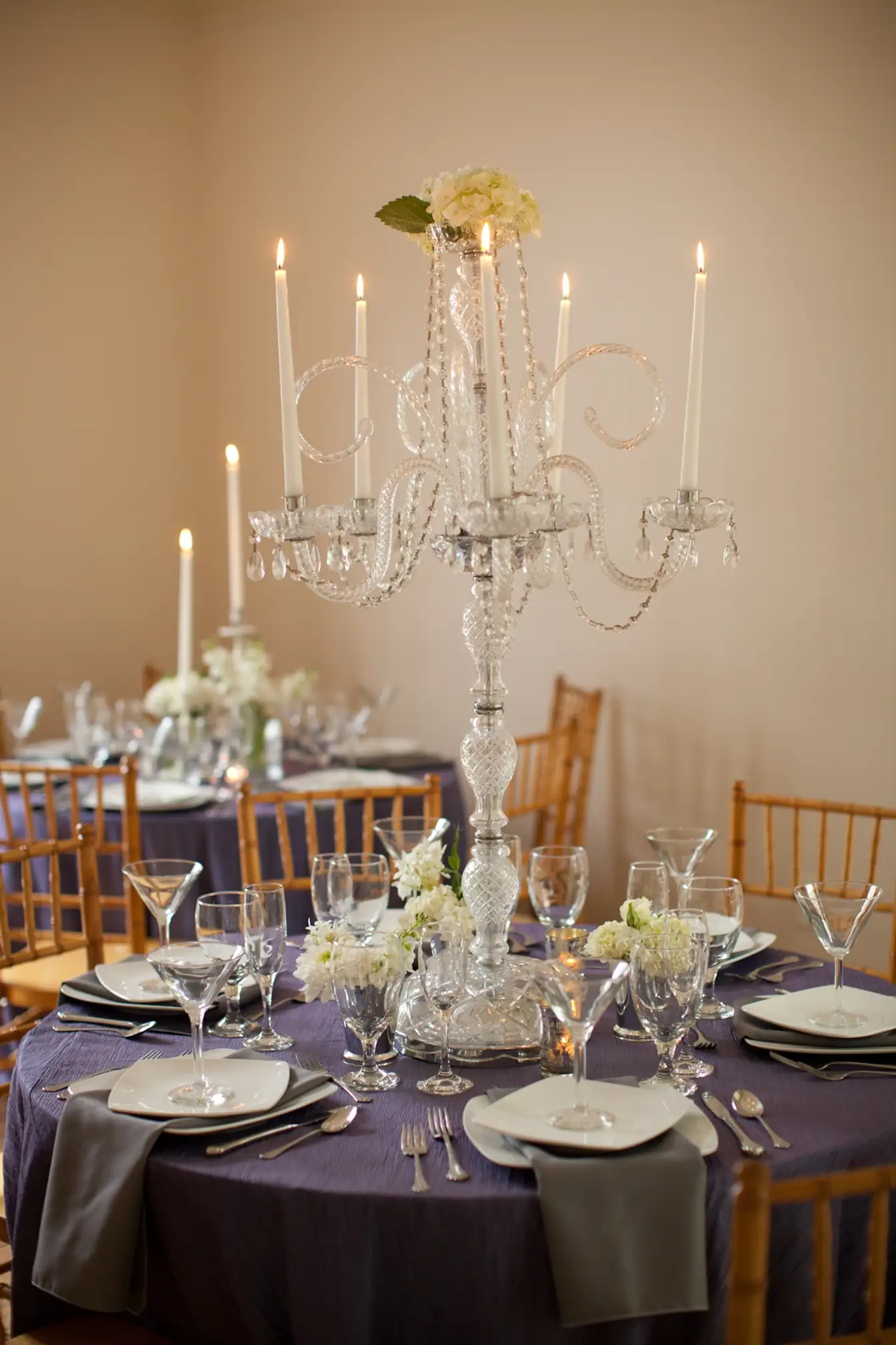 Crystal candelabra centerpiece over a lavender tablescape with Chiavari chairs